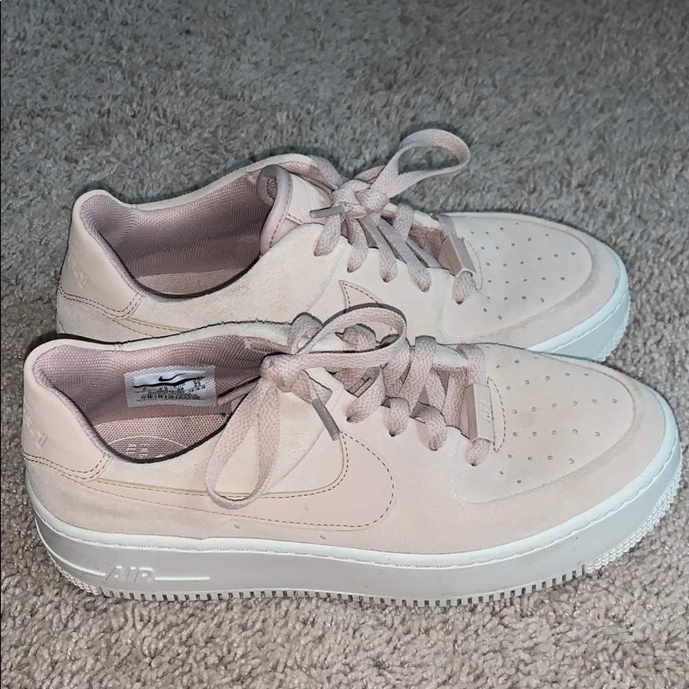 Blush Nike Air Force platform sneakers